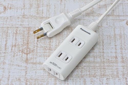 a white wii controller sitting on top of a table at Wakayama Urban Hotel in Wakayama