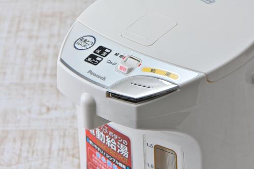 an atm machine with avertisement at Wakayama Urban Hotel in Wakayama
