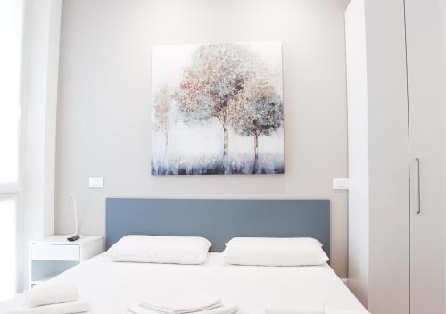 Postel nebo postele na pokoji v ubytování BMP APARTMENT ATMOSPHERE 1 CENTRALE con GARAGE