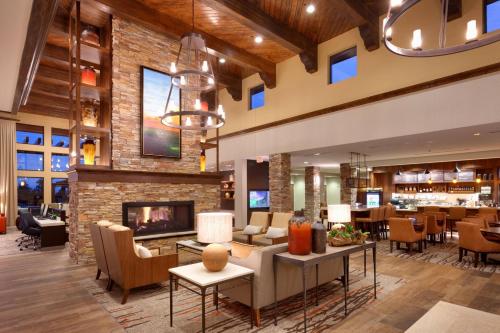 a lobby of a hotel with a fireplace at Courtyard by Marriott Sedona in Sedona