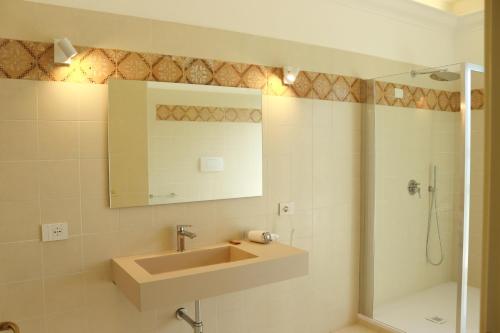 a bathroom with a sink and a shower at Primavilla Relais in Gaeta