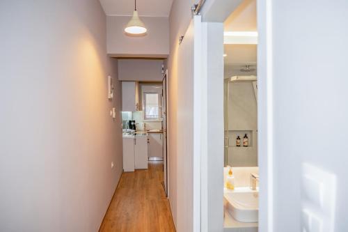 a bathroom with a toilet and a sink at Acropolis Terrace View Apartment in Athens