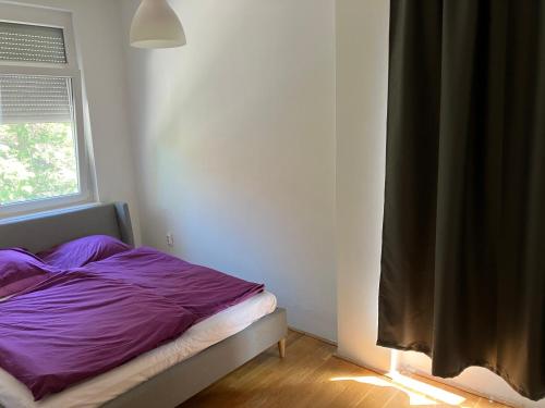 Postel nebo postele na pokoji v ubytování Honvéd n4. apartman