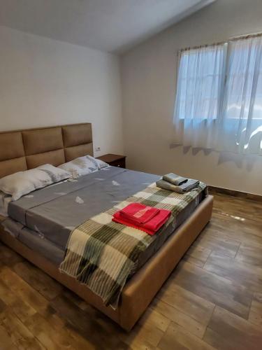 a bedroom with a bed with a blanket on it at Sirena Agroturizem in (( Stan i Ri ))