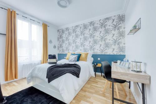 a bedroom with a bed and a desk and a window at Bundle Famille Max - 12 personnes in La Courneuve