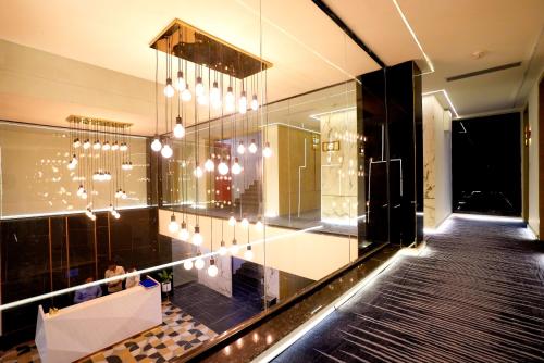 a lobby of a building with a chandelier at Hotel Limon & Banquet Sector 29, Gurgaon in Gurgaon
