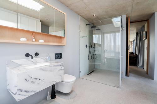 a bathroom with a sink and a toilet and a shower at Mi Amor Myoli Beach in Sedgefield