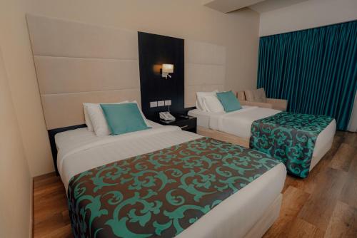 Un ou plusieurs lits dans un hébergement de l'établissement Carmel Hotel Ramallah