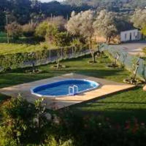 an overhead view of a swimming pool in a yard at Charming Studio with Pool, Mountain View in Monchique, 50sqm in Monchique