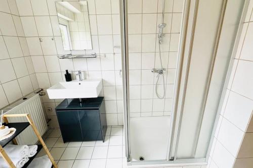 a bathroom with a shower and a sink at Schöne Wohnung "Bethel" in Bad Hersfeld in Bad Hersfeld