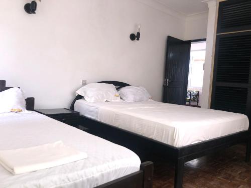 Katil atau katil-katil dalam bilik di Wayside Beach Apartments