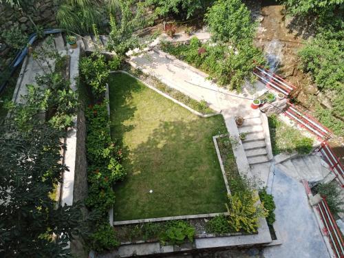an overhead view of a garden with trees and bushes at Hotel Red Roof & Restaurant in Abbottabad