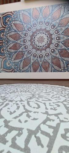 a picture of a floor with a painting on the wall at Jurtarelax in Kozármisleny