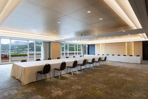 a large meeting room with a long table and chairs at The Westin Miyako Kyoto in Kyoto
