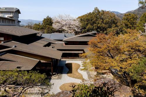an overhead view of a building with trees in the foreground at The Westin Miyako Kyoto in Kyoto