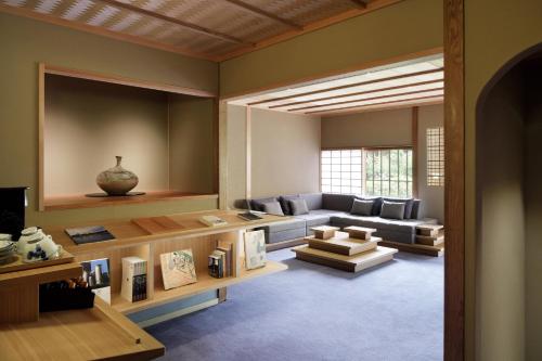 a living room with a couch and a table at The Westin Miyako Kyoto in Kyoto