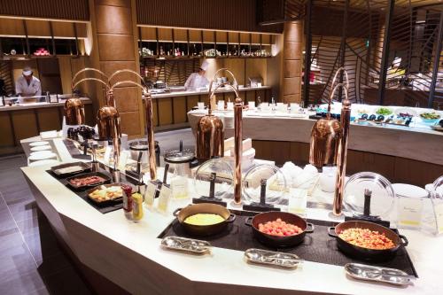 a buffet line with many different types of food at The Westin Miyako Kyoto in Kyoto