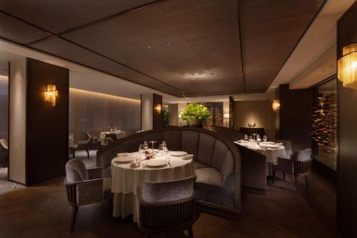 a dining room with tables and chairs and tablesktop at The Westin Miyako Kyoto in Kyoto