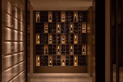 a wine cellar with a wall of wine bottles at The Westin Miyako Kyoto in Kyoto