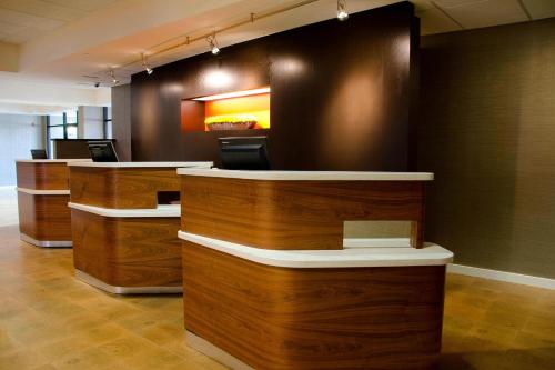 an office with wooden counters and a counter top at Courtyard Waterbury Downtown in Waterbury