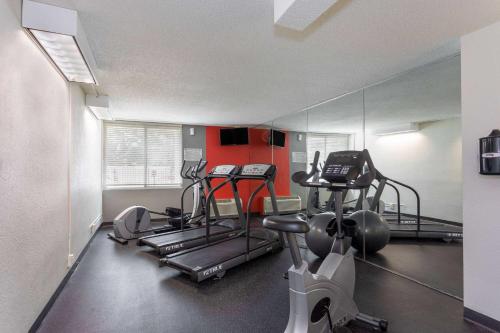 a gym with two tread machines and a mirror at Wyndham Garden Tallahassee Capitol Near FSU in Tallahassee