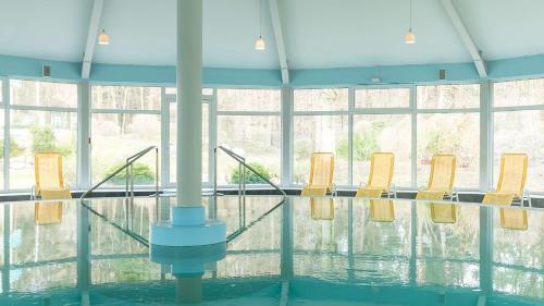 a group of chairs sitting in a pool of water at Dorint Seehotel Binz-Therme in Binz