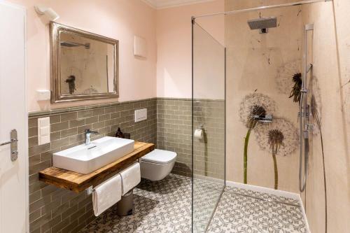 a bathroom with a sink and a shower at Villa Wickenburg in Salzburg