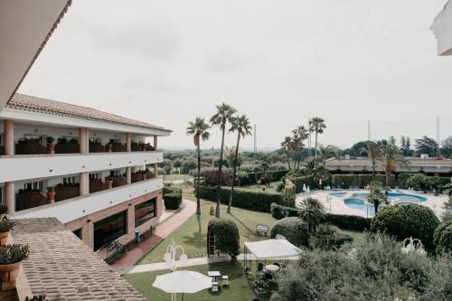 an aerial view of a resort with a swimming pool at Mas Gallau in Cambrils
