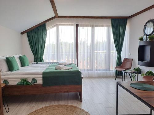 Ένα ή περισσότερα κρεβάτια σε δωμάτιο στο Premium StudioApartment in Borovets Gardens