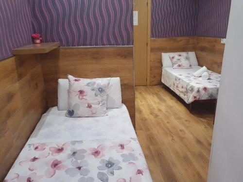 Ένα ή περισσότερα κρεβάτια σε δωμάτιο στο Hostal Abel Victoriano