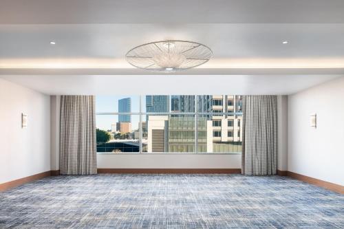 a large room with a large window with a view at The Ritz-Carlton, Los Angeles L.A. Live in Los Angeles