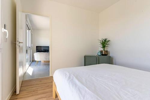 En eller flere senge i et værelse på Saint Gilles Croix de vie: Appartement T2