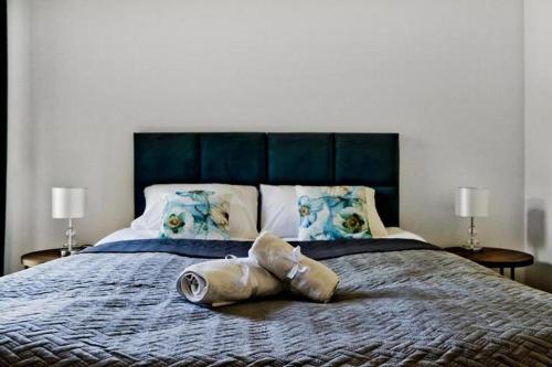 Ένα ή περισσότερα κρεβάτια σε δωμάτιο στο Apartamenty In Belnihel