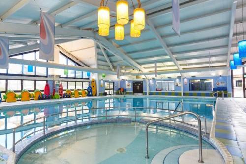 a large swimming pool with a large swimming pool at Julie'scaravan lettings in Kirby Cross