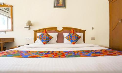 Postel nebo postele na pokoji v ubytování FabHotel Altus