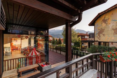 a balcony with a view of a building at Ruskovets Thermal SPA & Ski Resort in Bansko