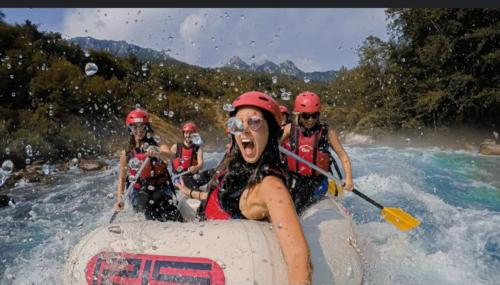 a group of people in a raft on a river at Lux Apartman Casablanca in Pluzine