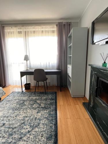 Μια τηλεόραση ή/και κέντρο ψυχαγωγίας στο Apartament z małym spa