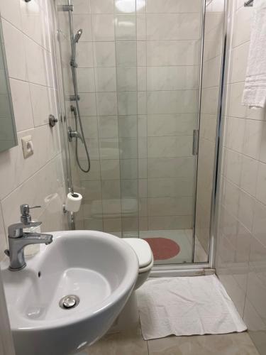 a bathroom with a shower and a sink and a toilet at Relax On 2 - Guesthouse in Rome