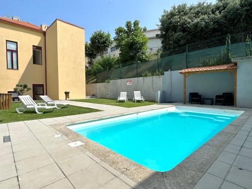 a swimming pool in the yard of a house at Art Cottage with oPorto View! in Vila Nova de Gaia