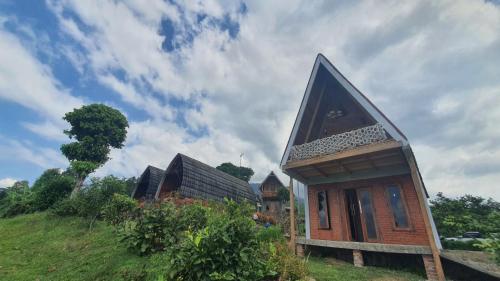 a small house on top of a hill at Villa Lumbung Salak in Bogor