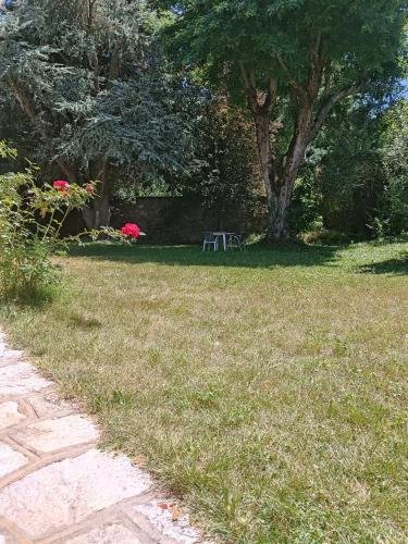 a park with a picnic table in the grass at L'Imprévu Saint Lary Soulan in Saint-Lary-Soulan