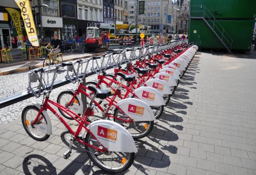 a row of red bikes parked in a row at Cozy Antwerp - Zurenborg Skyline in Antwerp