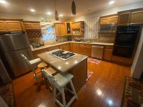 an overhead view of a kitchen with wooden cabinets at Chateau la Mel in Mandeville