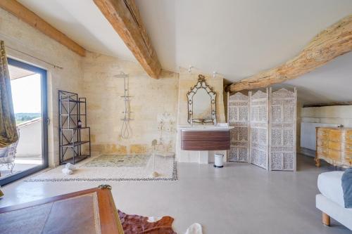 a bathroom with a shower and a sink in a room at Le Castel de Castillon - Maison d'exception à 10 minutes de Saint Emilion in Castillon-la-Bataille