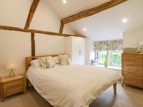 Säng eller sängar i ett rum på Fern Cottage