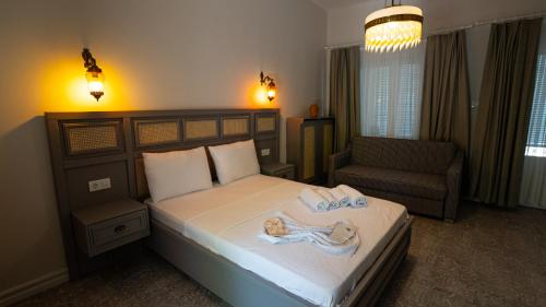 Postel nebo postele na pokoji v ubytování Büyükada Ece Suit