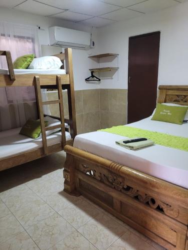 a room with two bunk beds in a room at posada barrios mar in Cartagena de Indias
