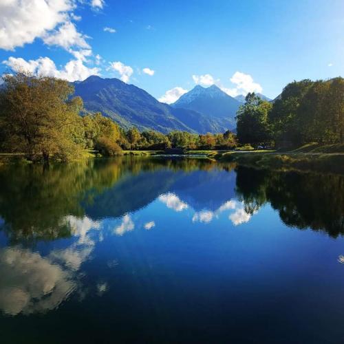 a view of a lake with mountains in the background at L'Imprévu Saint Lary Soulan in Saint-Lary-Soulan