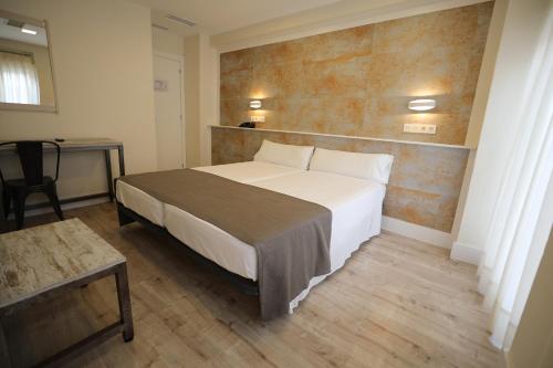 A bed or beds in a room at YIT Casablanca